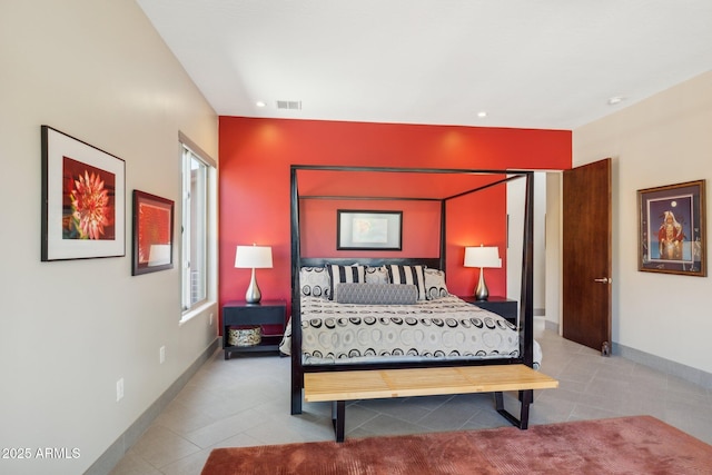 tiled bedroom with visible vents and baseboards