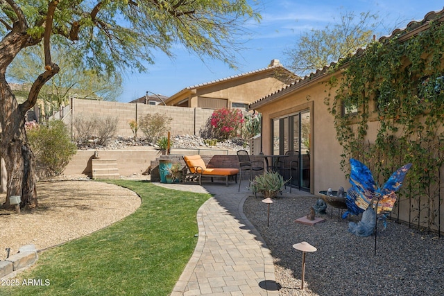 view of yard with a patio and a fenced backyard