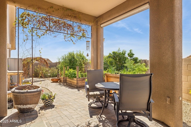 view of patio featuring fence