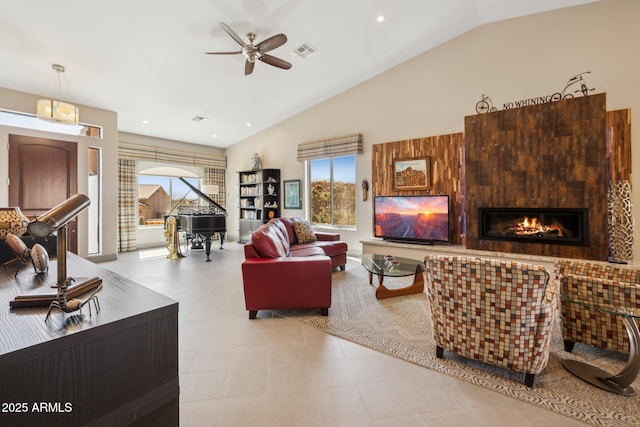 living room with recessed lighting, a glass covered fireplace, visible vents, and a ceiling fan