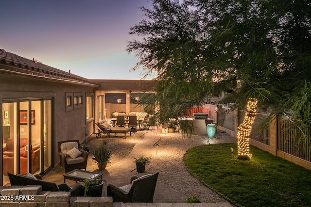 view of yard with an outdoor living space, a patio area, and a fenced backyard