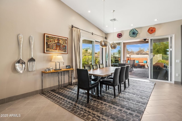 tiled dining area featuring high vaulted ceiling, baseboards, visible vents, and recessed lighting