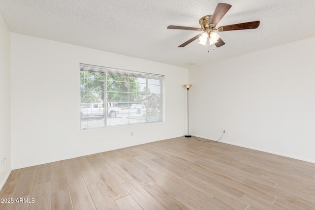 2031 W Gila Ln, Chandler, AZ 85224 - spare room featuring light wood finished floors, a ceiling fan, and a textured ceiling