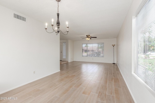 2031 W Gila Ln, Chandler, AZ 85224 - empty room with a chandelier, light wood-style flooring, ceiling fan, baseboards, and a textured ceiling