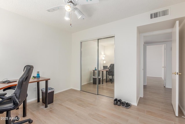 2031 W Gila Ln, Chandler, AZ 85224 - home office featuring light wood-style floors, ceiling fan, a textured ceiling, and baseboards
