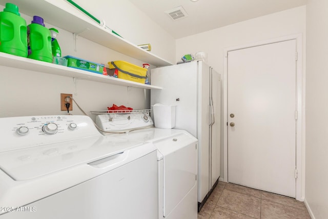 2031 W Gila Ln, Chandler, AZ 85224 - washroom featuring independent washer and dryer and light tile patterned flooring