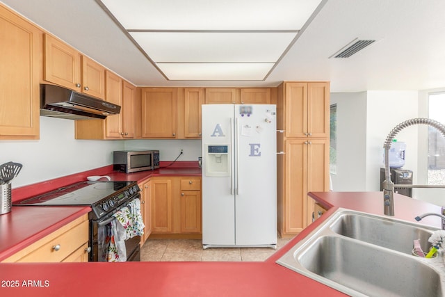 2031 W Gila Ln, Chandler, AZ 85224 - kitchen featuring white refrigerator with ice dispenser, under cabinet range hood, black electric range, stainless steel microwave, and a sink