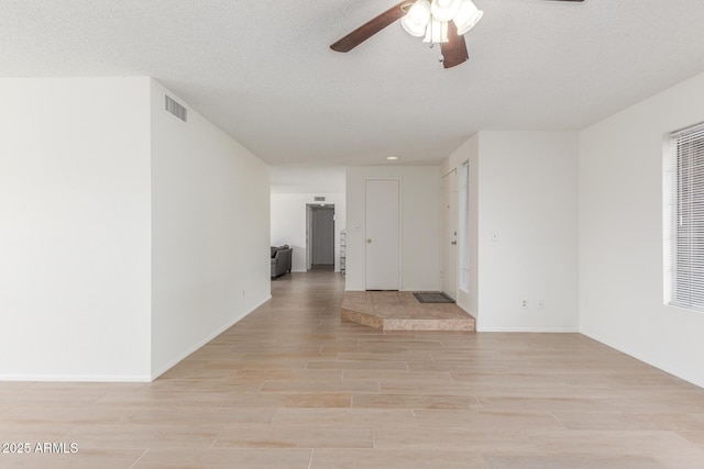 2031 W Gila Ln, Chandler, AZ 85224 - spare room with a ceiling fan, light wood finished floors, and baseboards