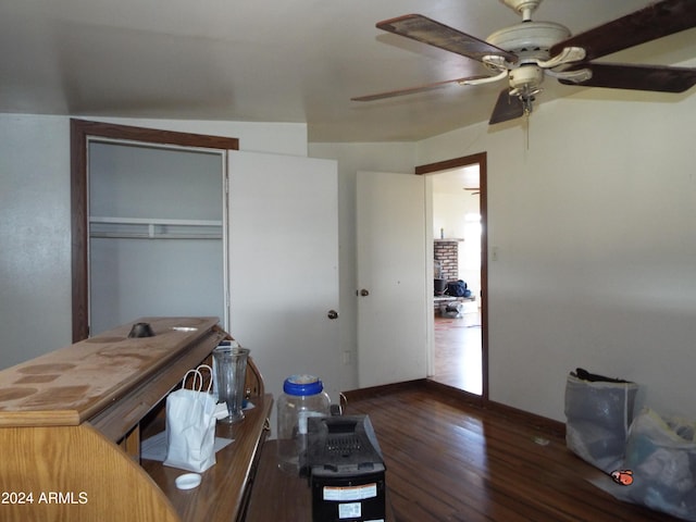 office area with dark hardwood / wood-style flooring and ceiling fan