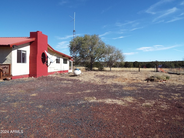 view of yard with a rural view