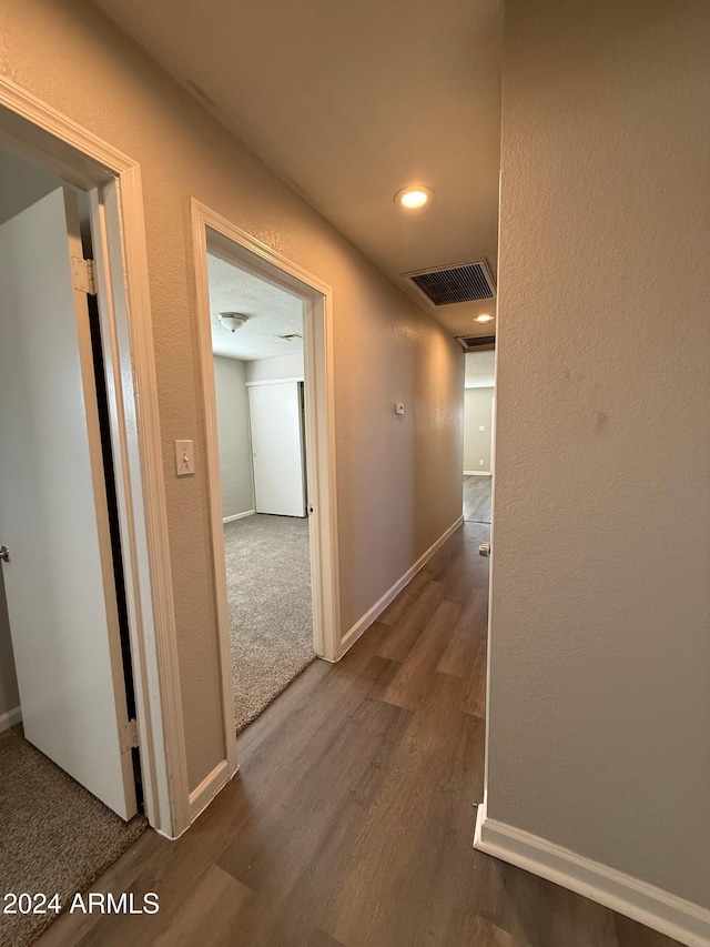 hallway featuring dark hardwood / wood-style floors