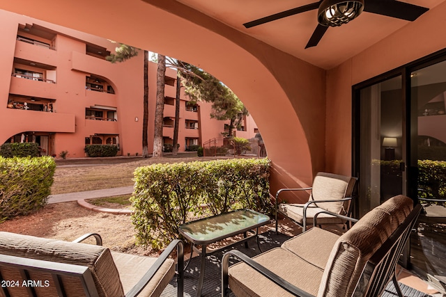 view of patio featuring a balcony and ceiling fan