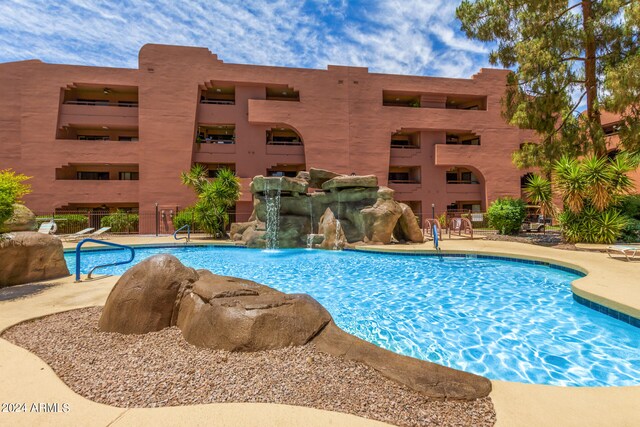 view of pool featuring pool water feature