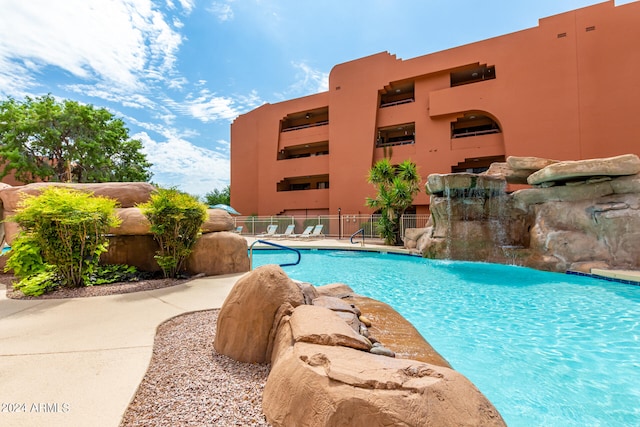 view of pool featuring pool water feature