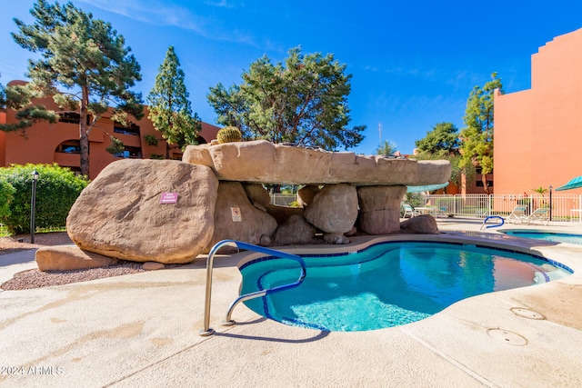 view of swimming pool featuring a patio area