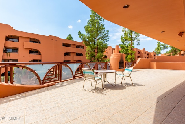 view of patio featuring a balcony