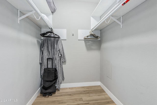 walk in closet featuring wood-type flooring