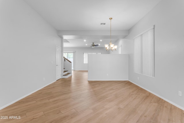 unfurnished room with a chandelier and light hardwood / wood-style flooring