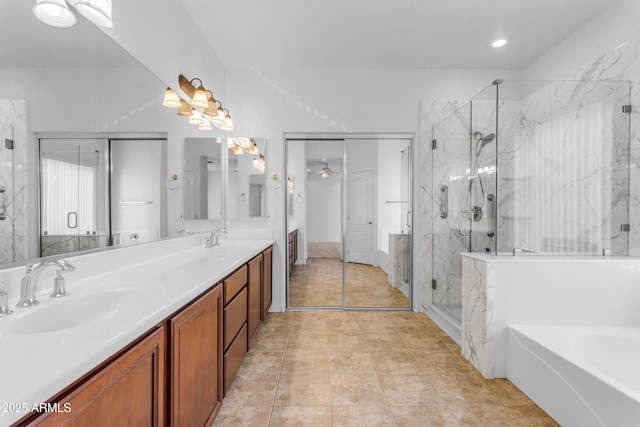 bathroom featuring ceiling fan, vanity, independent shower and bath, and tile patterned flooring