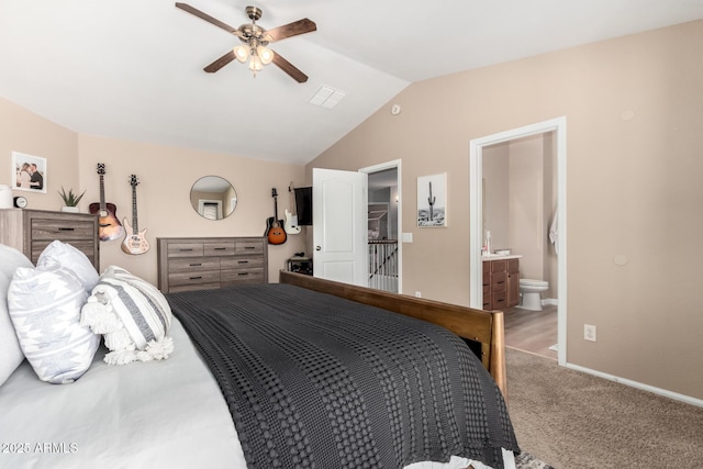 bedroom with ensuite bathroom, lofted ceiling, light colored carpet, and ceiling fan