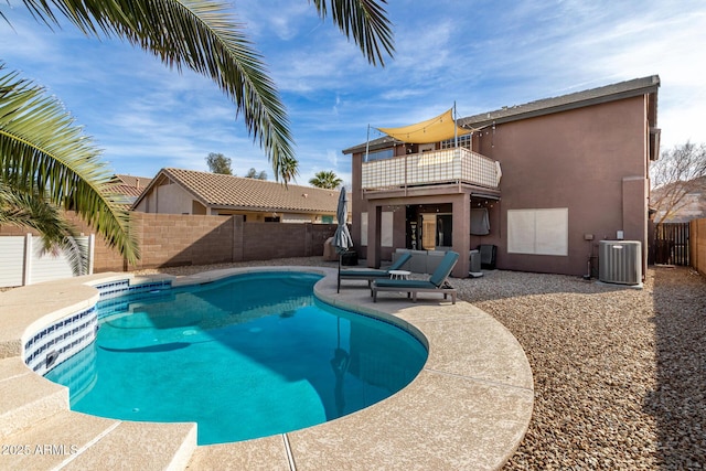 view of pool with central AC unit and a patio area