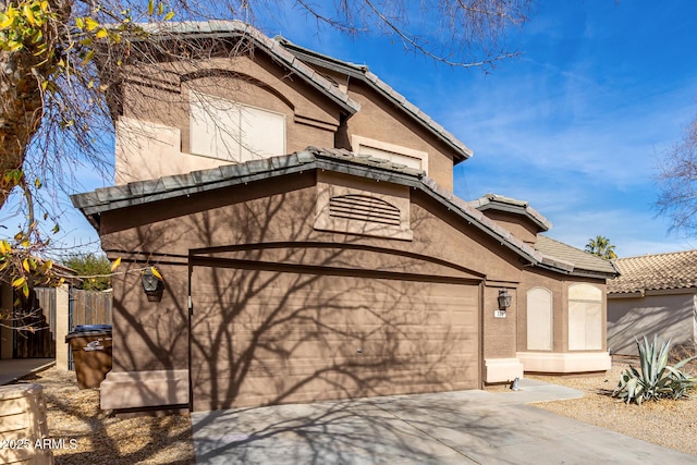 view of side of home featuring a garage