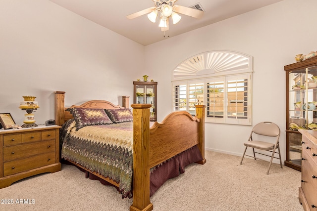 bedroom featuring baseboards, visible vents, a ceiling fan, and light carpet