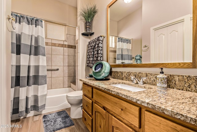 bathroom featuring toilet, vanity, and shower / bathtub combination with curtain