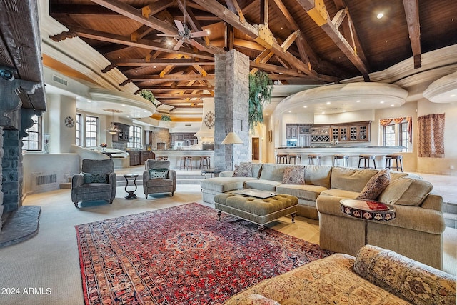 carpeted living room featuring wood ceiling, beam ceiling, and high vaulted ceiling