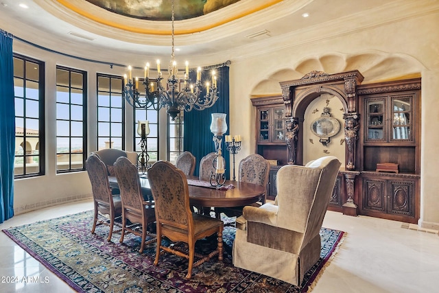 tiled dining area with a notable chandelier, a raised ceiling, and ornamental molding