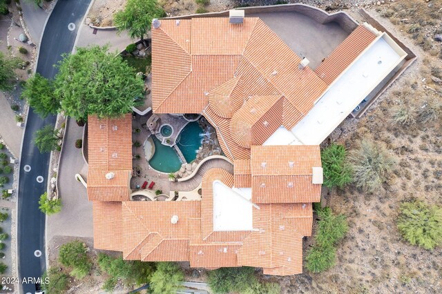 patio terrace at dusk featuring ceiling fan, area for grilling, grilling area, and exterior fireplace