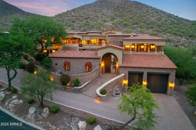 view of patio / terrace featuring a balcony, a mountain view, and area for grilling