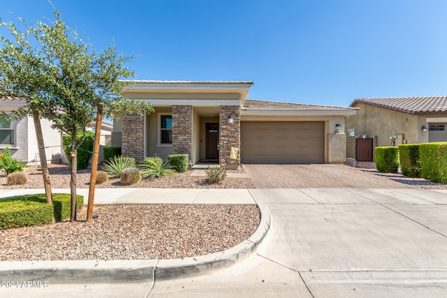 prairie-style house featuring a garage