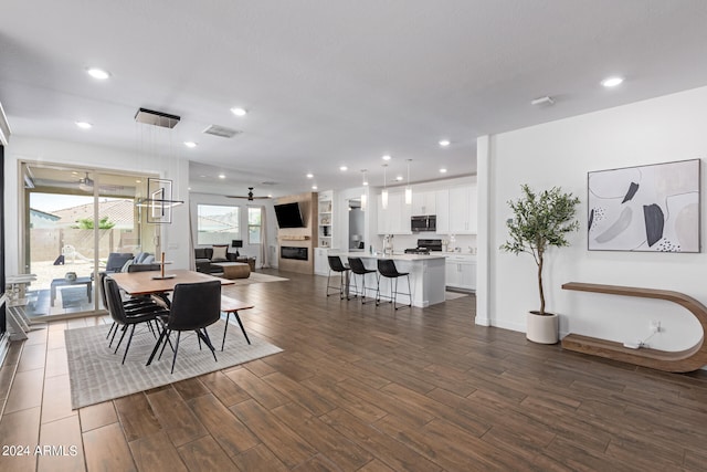 dining space featuring dark hardwood / wood-style floors