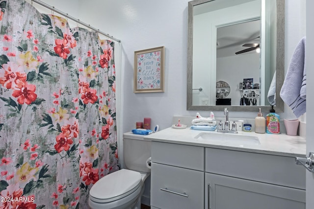 bathroom featuring ceiling fan, vanity, and toilet