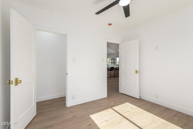 1338 E Granada Rd, Phoenix, AZ 85006 - unfurnished bedroom with wood finished floors and ceiling fan