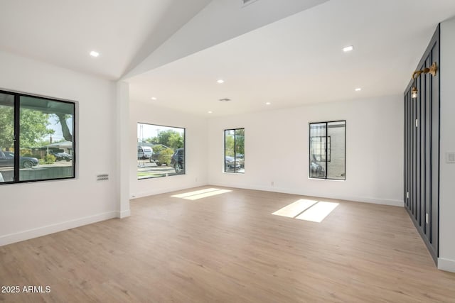1338 E Granada Rd, Phoenix, AZ 85006 - spare room featuring plenty of natural light, light wood-style floors, recessed lighting, and vaulted ceiling