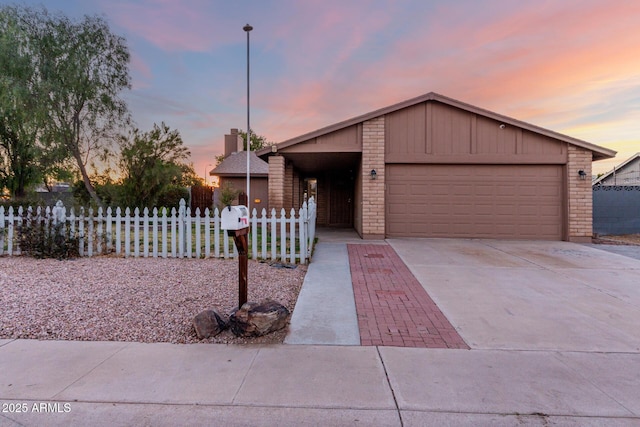 single story home featuring a garage