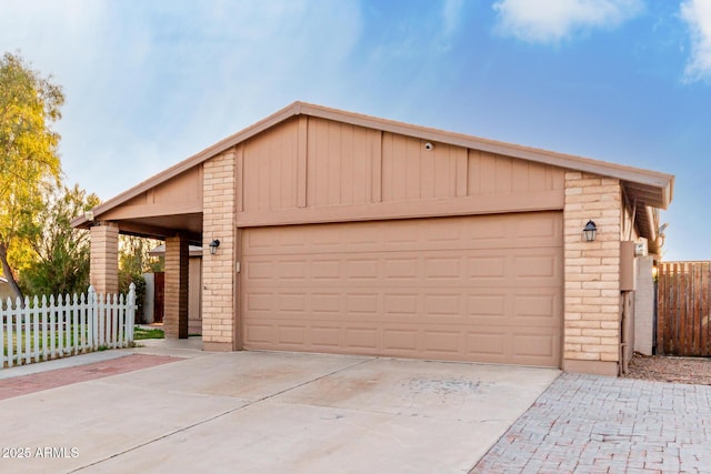 ranch-style house with a garage and an outdoor structure