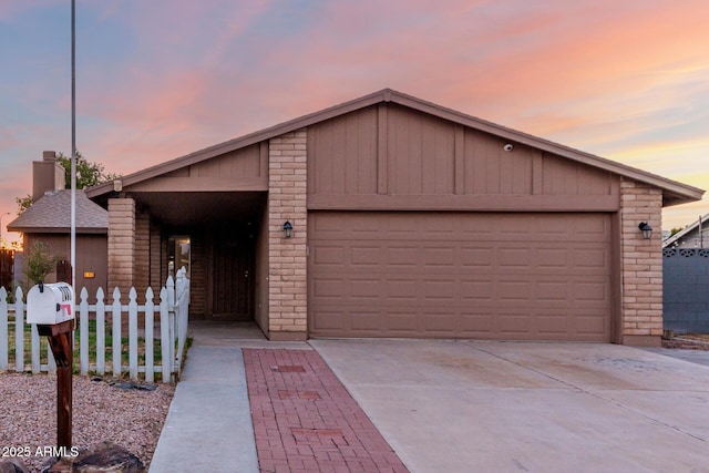 ranch-style home featuring a garage