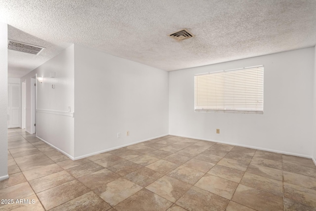 spare room featuring a textured ceiling