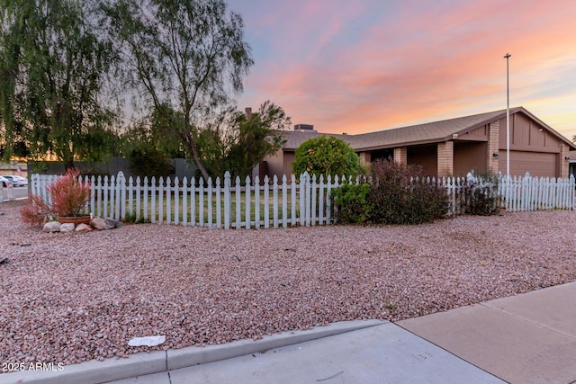 property exterior at dusk with a garage