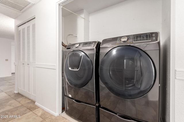 laundry area featuring washer and clothes dryer