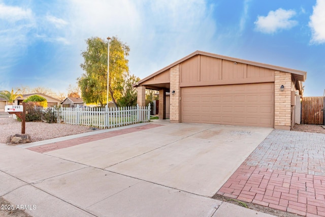 ranch-style house featuring a garage