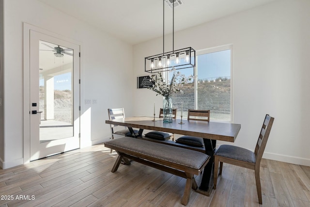 dining area with light hardwood / wood-style floors