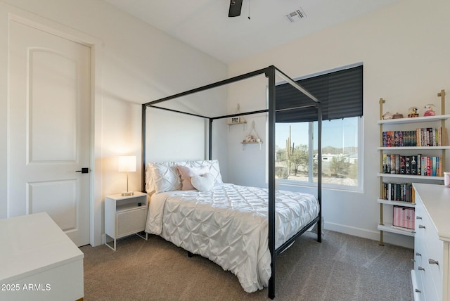 bedroom featuring ceiling fan and dark colored carpet