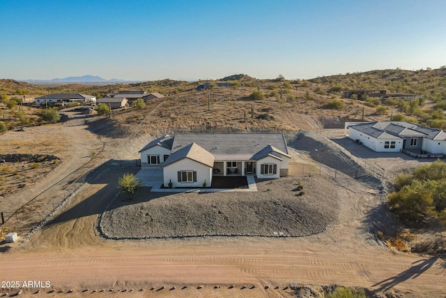 birds eye view of property with a mountain view