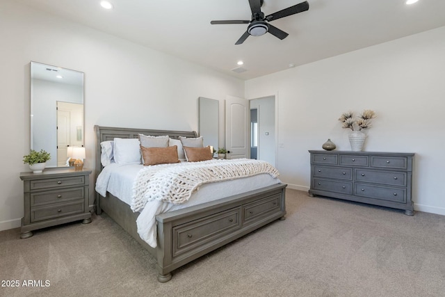 bedroom featuring light colored carpet and ceiling fan