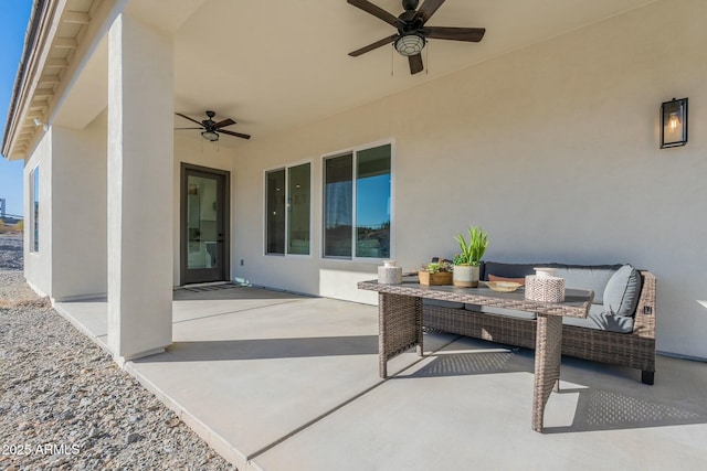 view of patio featuring an outdoor living space and ceiling fan