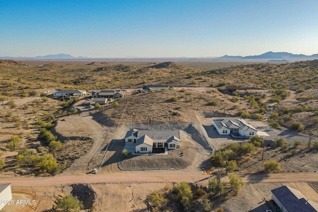 drone / aerial view featuring a mountain view